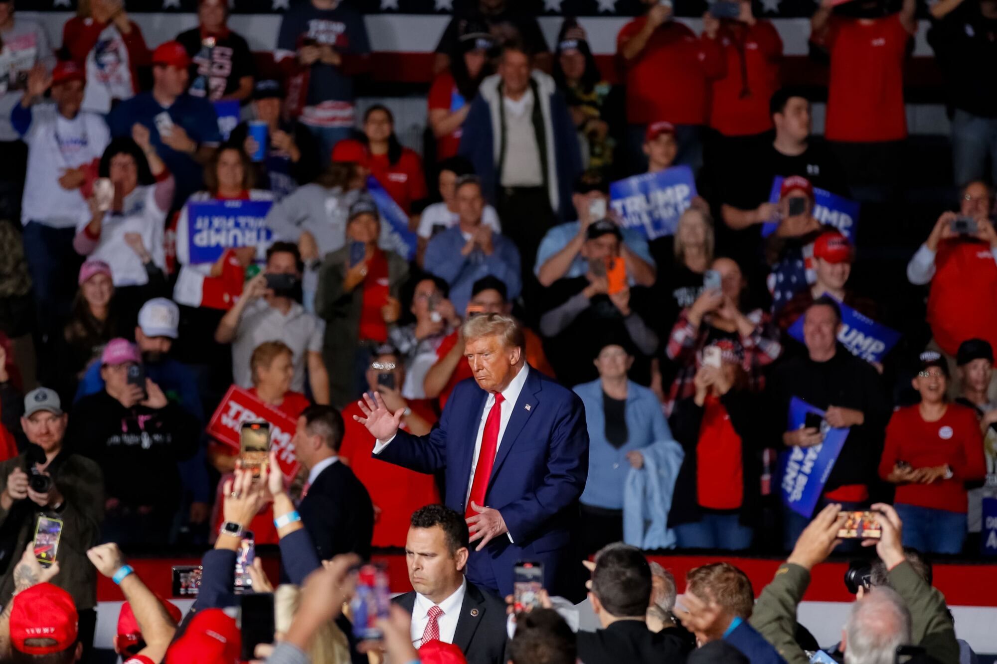 Trump arrives for a campaign rally at Van Andel Arena.