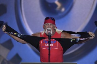 Hulk Hogan tears off his shirt while speaking on the final night of the 2024 RNC.