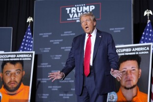 Donald Trump arrives for a campaign rally in Aurora, CO.