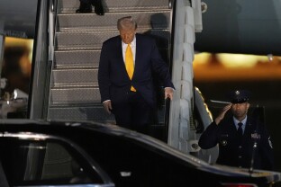Donald Trump exits Air Force One.