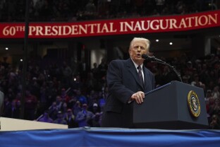 Trump speaks at an indoor Presidential Inauguration parade event at Capital One Arena.