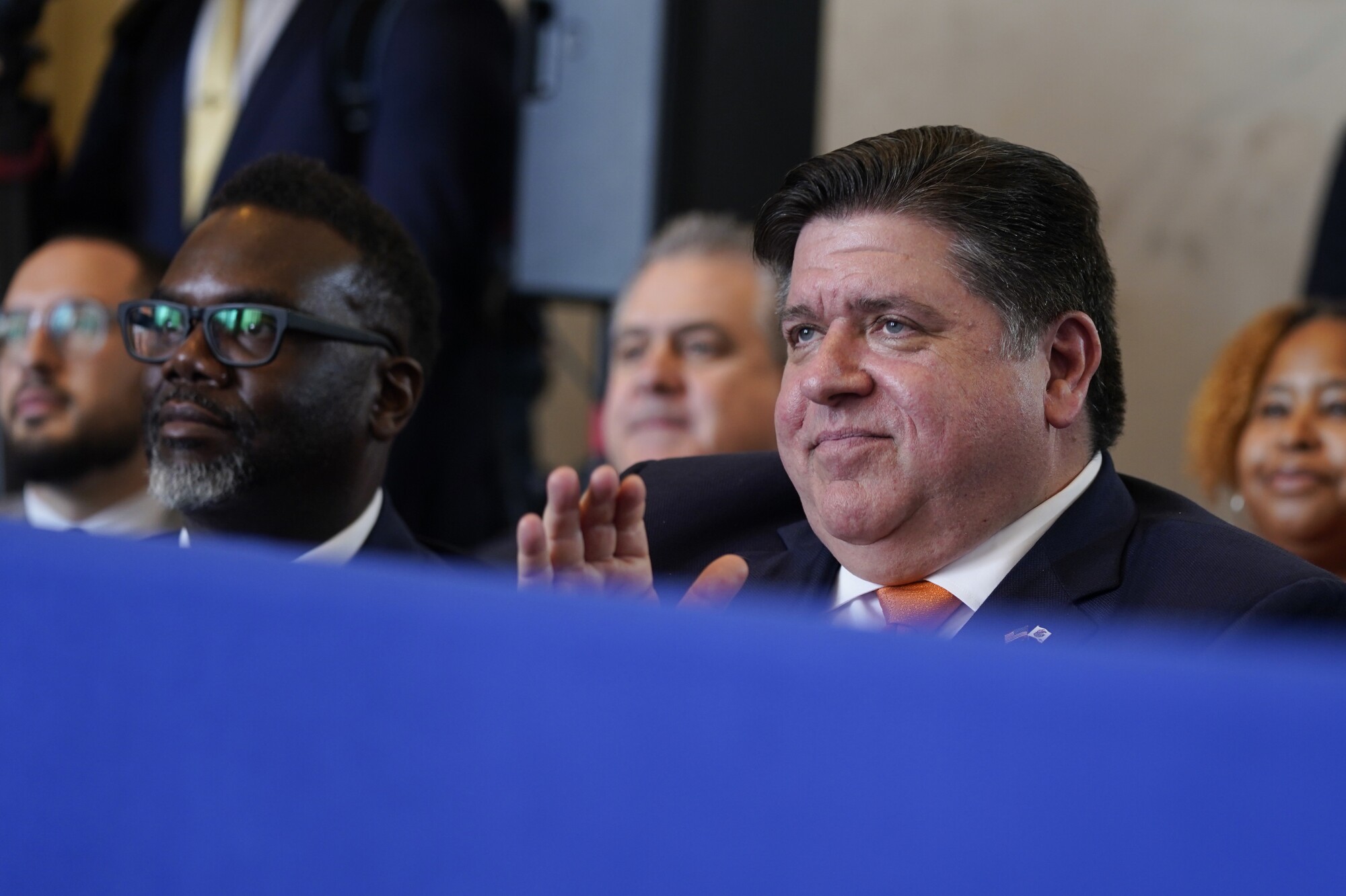 Gov. J.B. Pritzker, D-Ill., front right, and Chicago Mayor Brandon Johnson