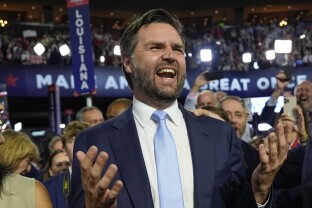 Republican vice presidential candidate Sen. JD Vance, R-Ohio, arrives on the floor during the first day of the 2024 Republican National Convention.