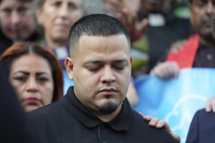 Kilmar Armando Abrego Garcia attends a protest rally.