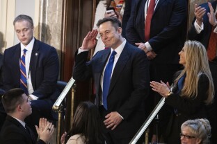 Musk salutes as Trump delivers an address to a joint session of Congress.