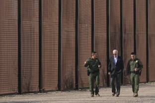 President Joe Biden walks along a stretch of the U.S.-Mexico border in El Paso Texas.