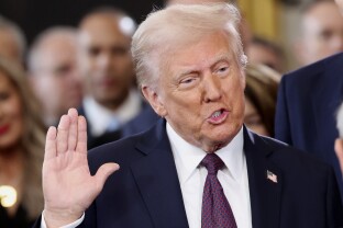 Donald Trump takes the oath of office.