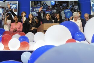 Kamala Harris celebrates with her families as the balloons fall.
