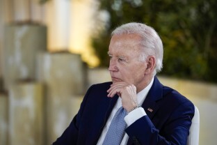President Joe Biden participates in a working session with world leaders during a G7 summit.