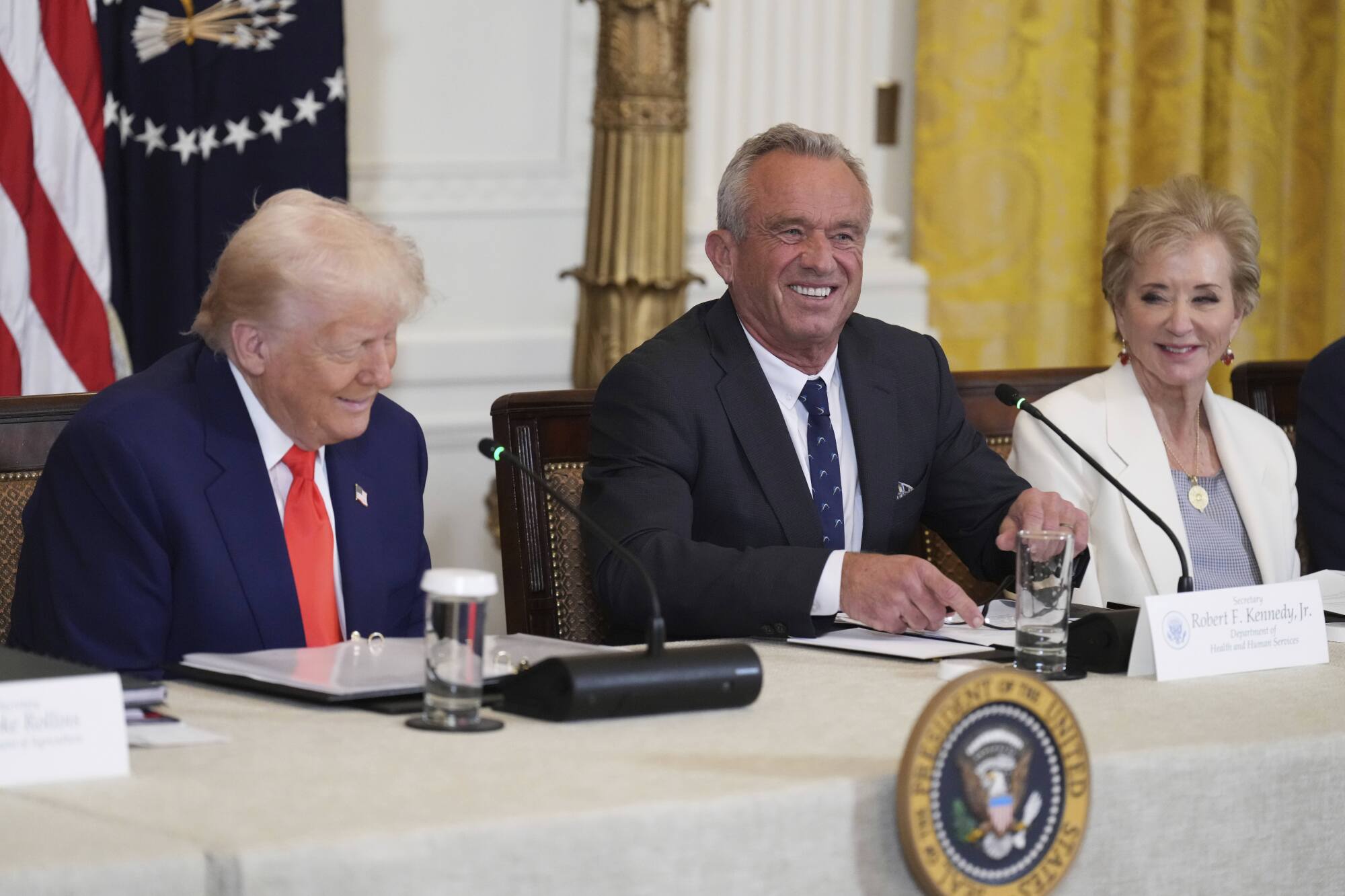 President Donald Trump, Health and Human Services Secretary Robert F. Kennedy Jr. and Education Secretary Linda McMahon.