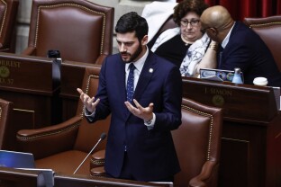 New York Assemblymember Alex Bores speaks at the state Capitol. 