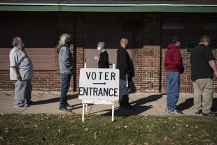 Voters wait in line outside a polling center on Election Day on Nov. 3, 2020 in Kenosha, WI.