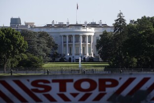 White House behind a vehicle barrier.