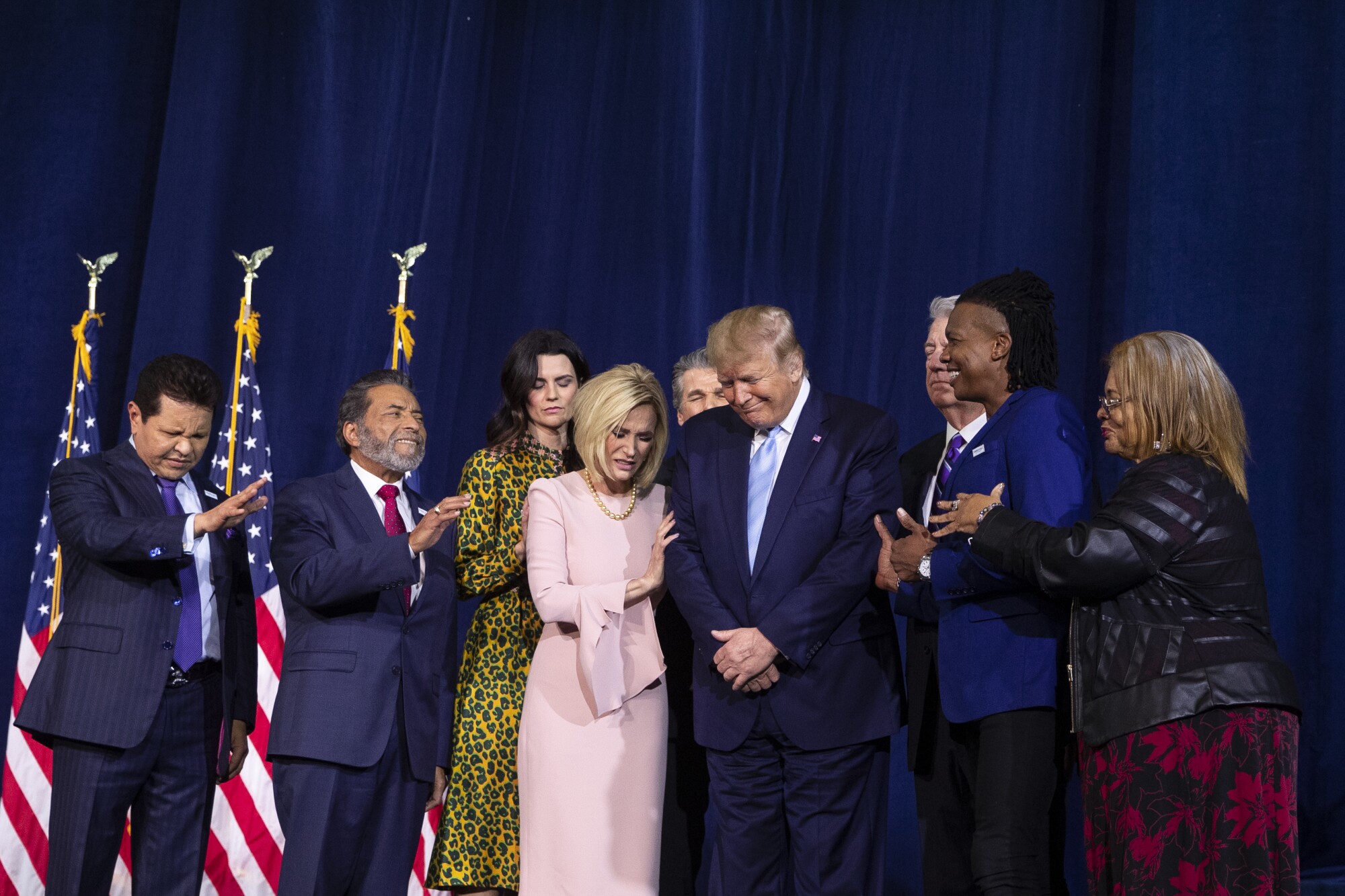 Faith leaders pray over President Donald Trump during an "Evangelicals for Trump Coalition Launch" in 2020.