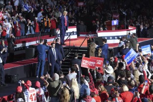 Trump arrives at a campaign rally at Van Andel Arena.