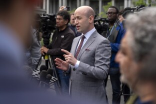 White House aide Stephen Miller speaks to reporters.