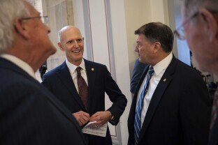 Senator Rick Scot greets Senator Mike Rounds