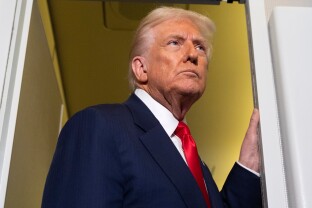 President Donald Trump speaks with reporters.