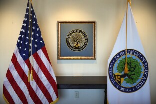 Flags decorate a space outside the office of the education secretary at the Education Department.