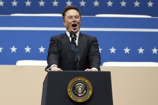 Elon Musk speaks at an indoor Presidential Inauguration parade.