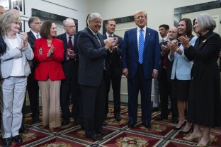 Trump arrives to speak with reporters at the NRSC.
